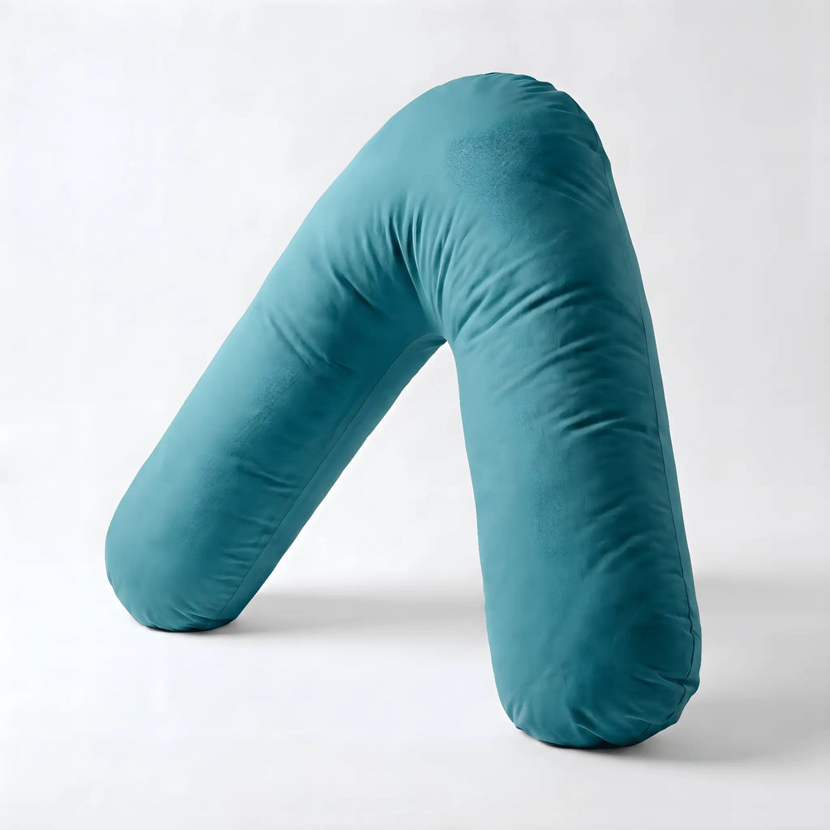 Teal Nurtura V-shaped support pillow showing its angled cushion design