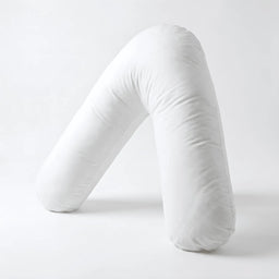 White Nurtura V-shaped support pillow displayed upright against a white background